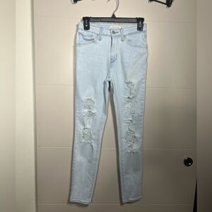 Levi's 721 High Rise Light Washed Distressed Skinny Jeans